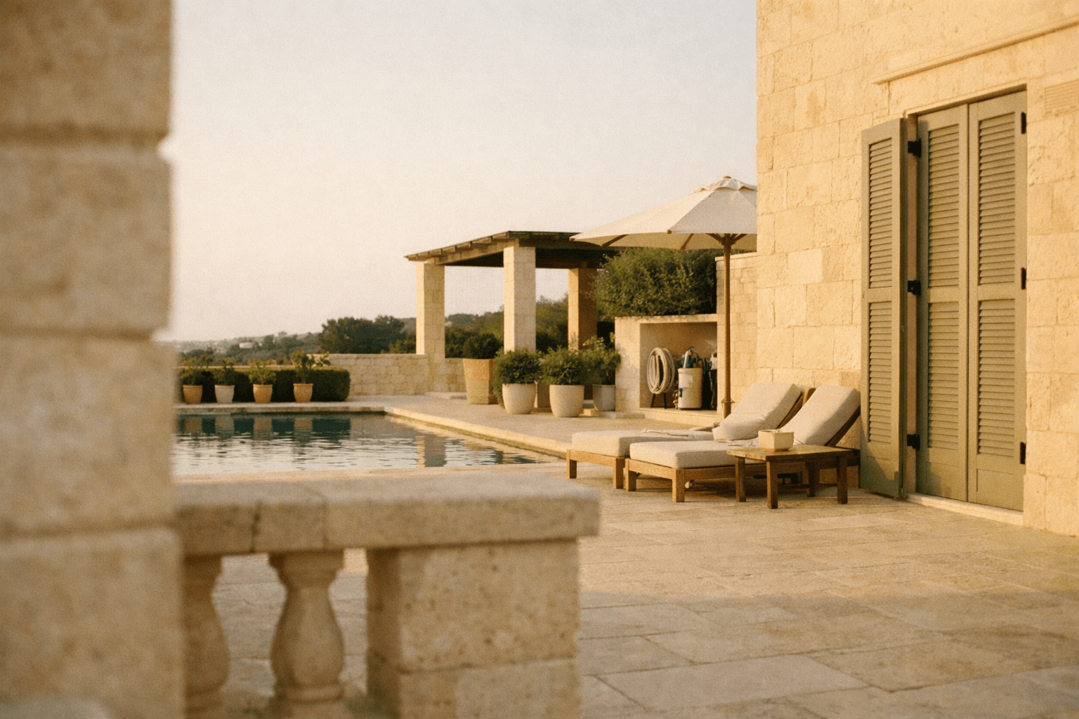 Villa terrace, late afternoon — the property is attended but the owner is absent
